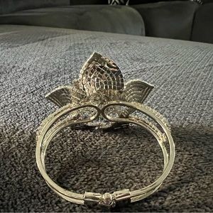 This bracelet is adorable Flower design silver overlay clasp is vey strong